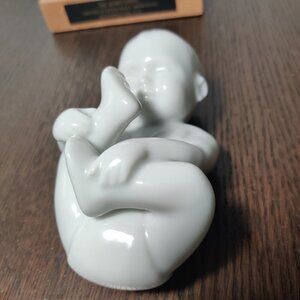 Babbling Baby porcelain figurine by Allan Therkelsen, Royal Copenhagen, Denmark